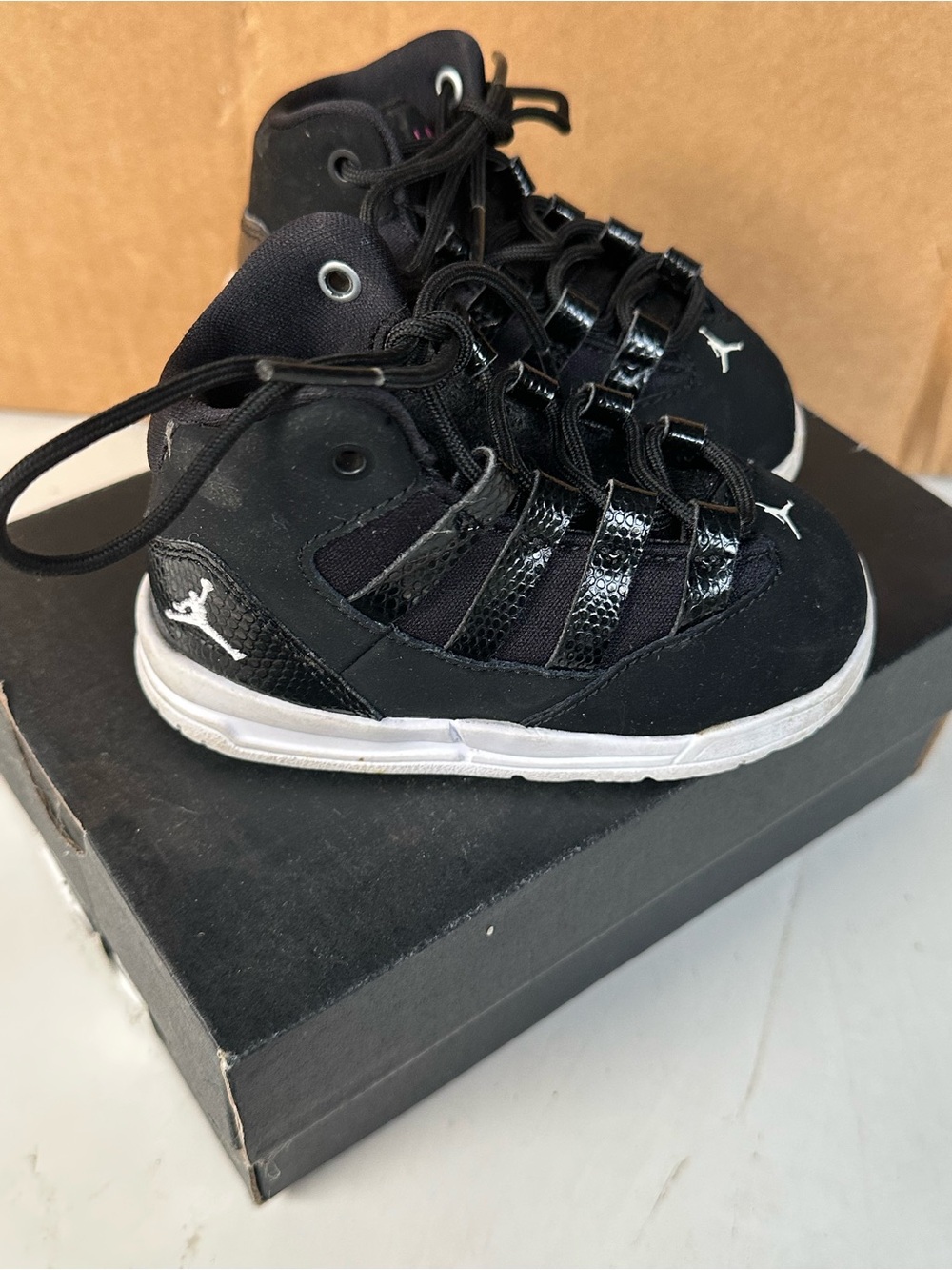 Jordan Kids Black and White High-Top Sneakers
